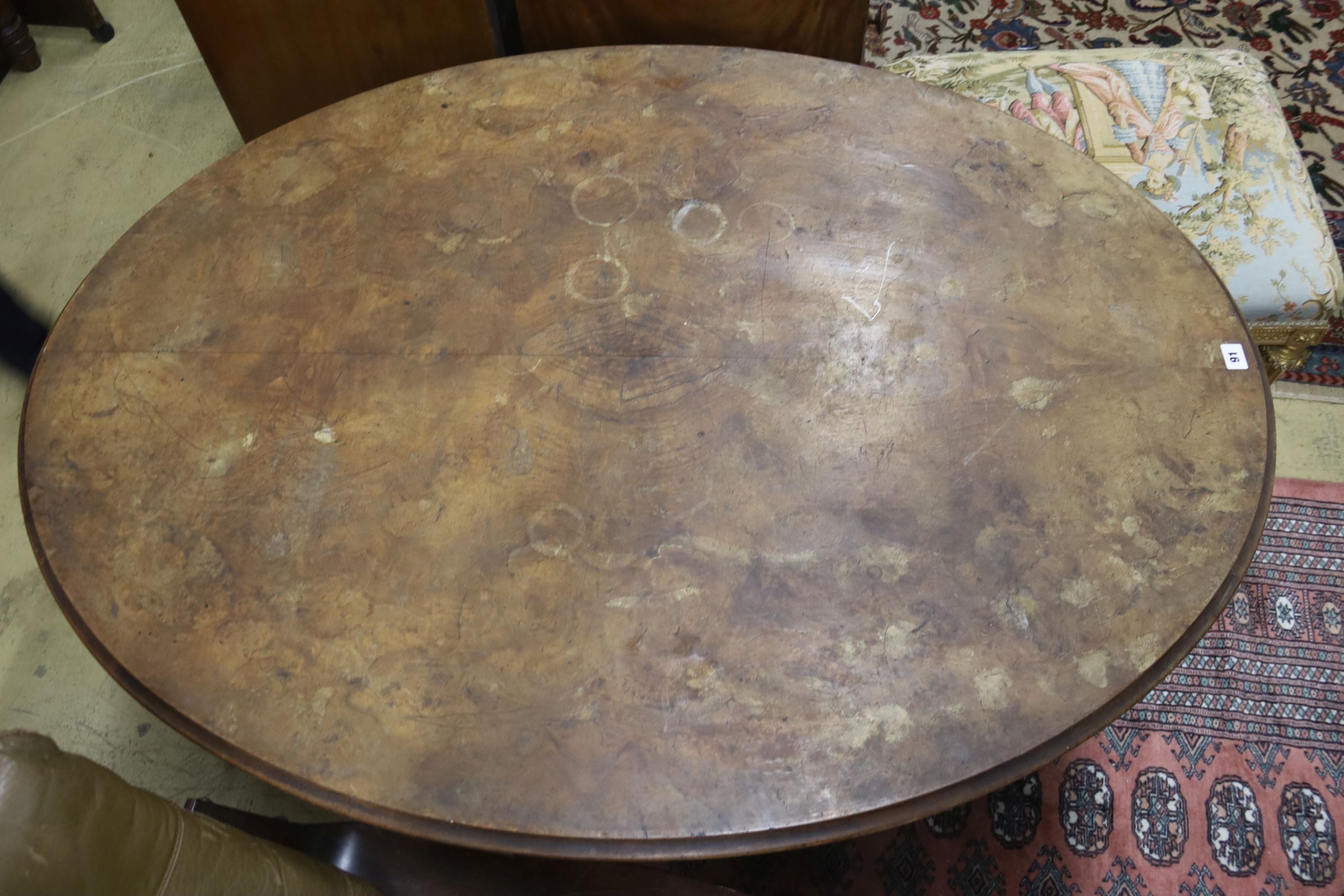 A Victorian oval figured walnut tilt top loo table, width 135cm, depth 100cm, height 72cm